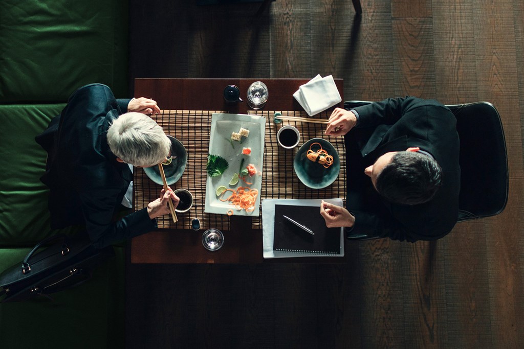 Two people having lunch during a business meeting.