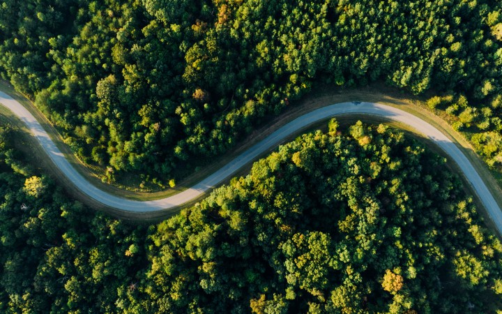 Aerial view of a road in a sustainable forest environment